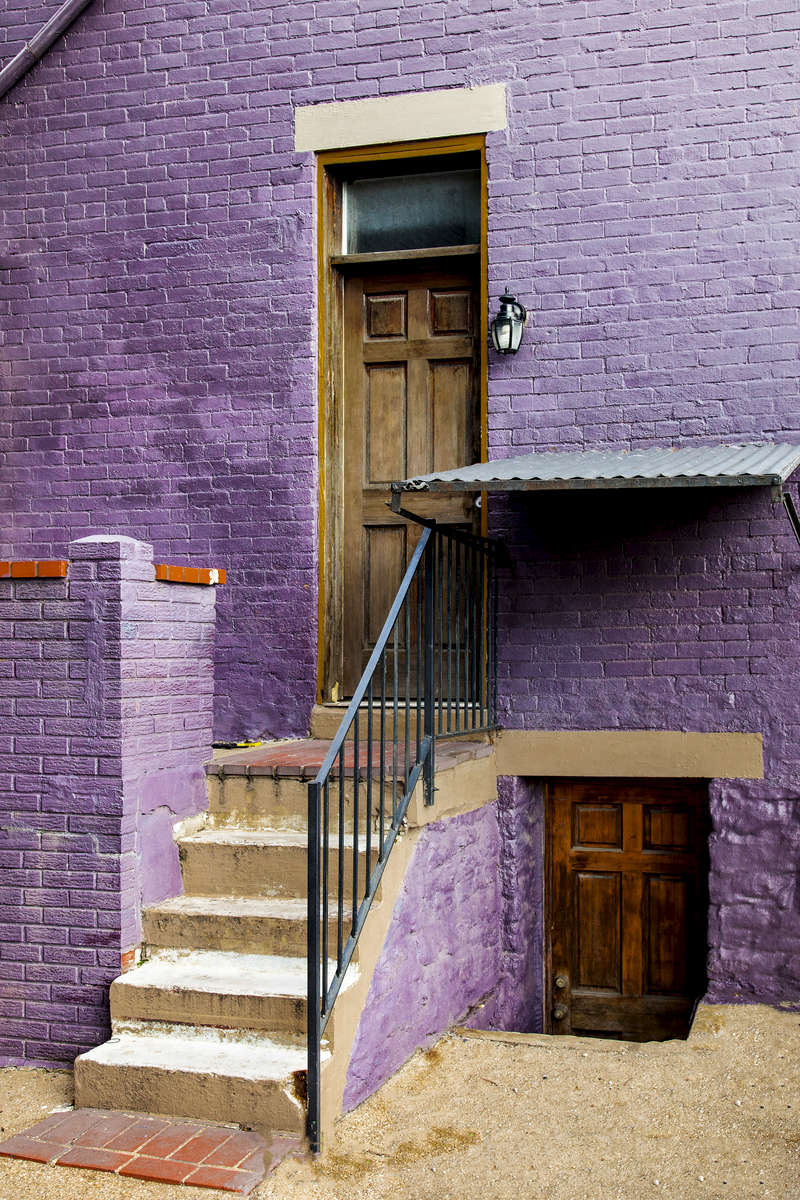 House tucked away in an alley off Liberty Street, near the historic Prospect Hill District, Cincinnati, Ohio.  Generally bounded by Liberty Street, Sycamore Avenue, Boal Street, Channing Street, and Highland Avenue (Mt. Auburn).  Prospect Hill was listed on the National Register of Historic Places on Sept. 4, 1980.  The Prospect Hill Historic District includes over 200 buildings, which together comprise a community of marked architectural significance. Built as single and double homes, the buildings,are mostly tall brick structures with long, narrow floor plates. Among the architectural styles in this hillside area are Italianate, Queen Anne, Federal, and Greek Revival, 