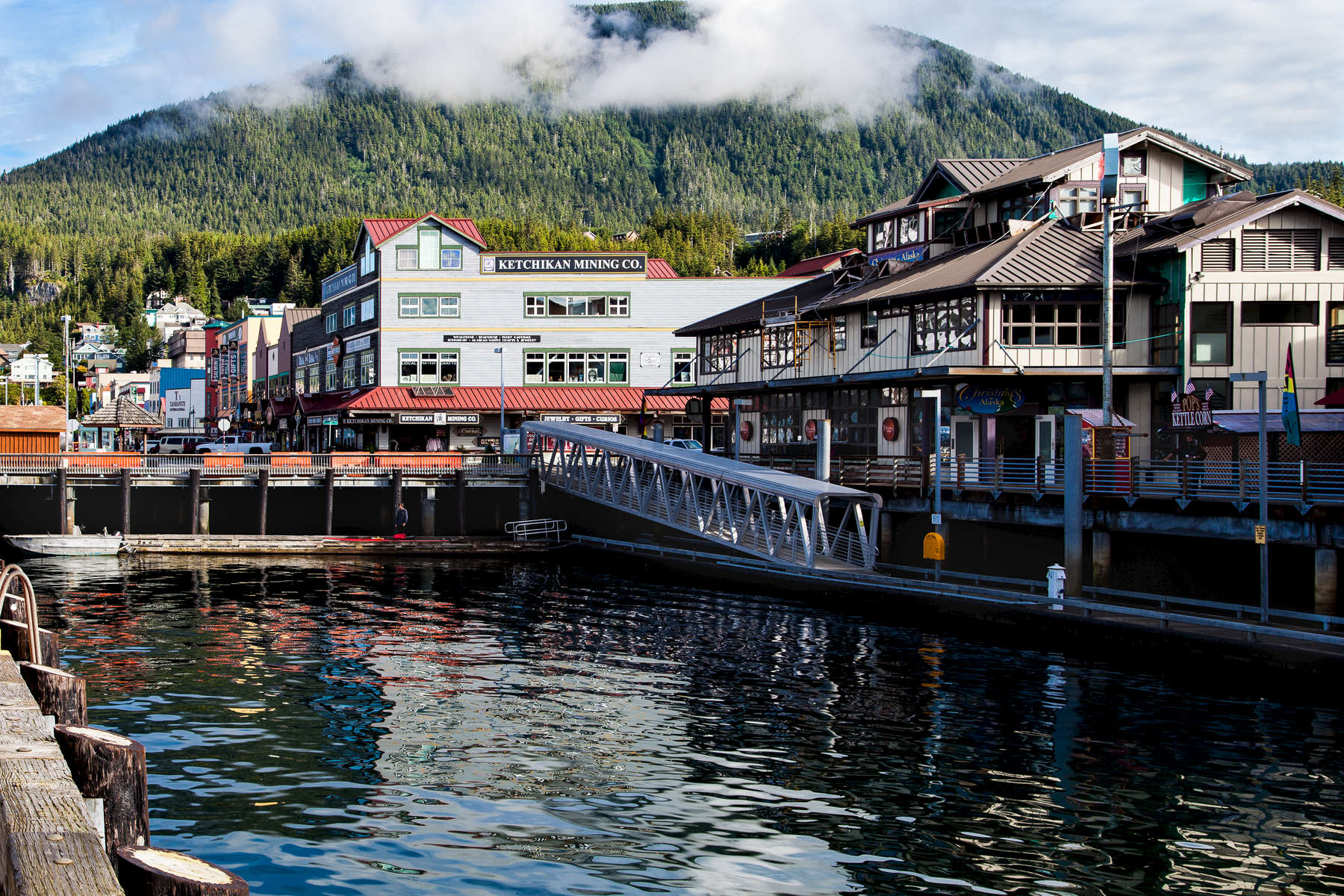 This is Salmon Landing in Ketchikan, AK.  Picturesque Ketchikan is located on Revillagigedo Island and clings to the banks of the Tongass Narrows, flanked by green forests and the Coast Mountains.    Ketchikan has long been an important hub of the salmon fishing and packing industries. 