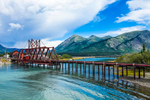 The White Pass and Yukon Route rail bridge over the strait between Bennett Lake and Nares Lake in Carcross, Yukon.  Nares Mountain is in the background.