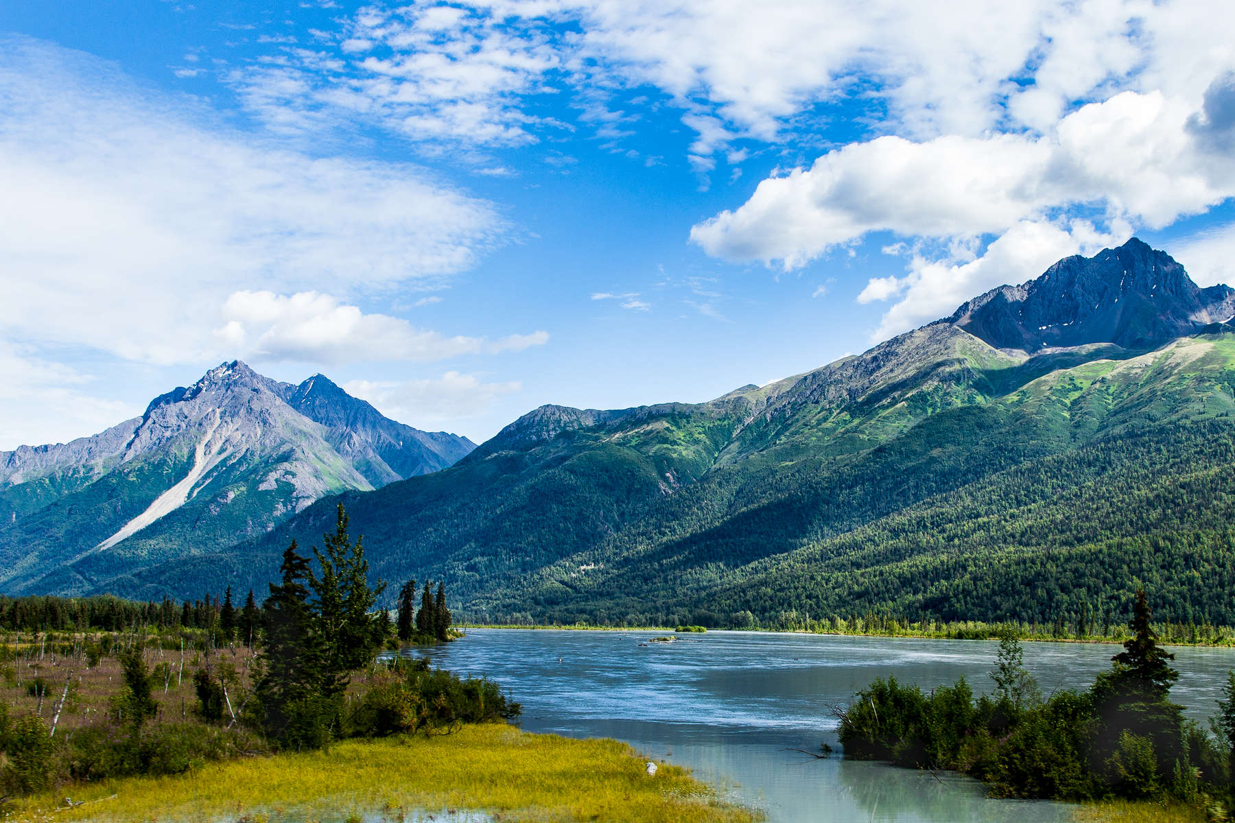 This is one of many tranquil lakes in the Talkeetna Mountains, south of the town of Talkeetna, Alaska.  The Talkeetnas are only a couple hours drive out of Anchorage - so you can eat breakfast in the city and lunch in the Talkeetna backcountry! 