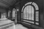 Memorial Hall OTR Cincinnati, OH.  Image from corridor outside gallery entrances highlighting beautiful arched windows overlooking Washington Park, and the United States flag as a memorial to the military of the city and county.