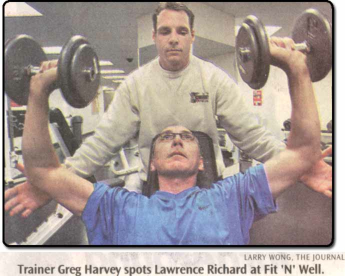 Larry Wong photographed Greg and Lawrence working out and demonstrating the proper technique of an incline shoulder press.