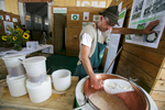 A man produces curd chese at the 53rd agricultural fair Agra in Gornja Radgona, Slovenia, Aug. 22, 2015.
