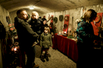 Visitors observe the advent wreaths exhibition in the underground tunnels in Kranj, Slovenia.