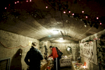 Visitors observe the advent wreaths exhibition in the underground tunnels in Kranj, Slovenia.