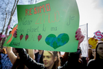 A protester holds a sign that reads 'Save Earth, it's the only planet with chocolate' during a Youth Climate Strike in Ljubljana, Slovenia on March 15. Around five thousand students protest inaction on climate change in Ljubljana, Slovenia,  as part of a global Youth Climate Strike on Friday, March 15. (Xinhua/Luka Dakskobler)
