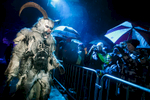 A participant dressed as a Krampus creature walks the street during the Krampus gathering in Goricane, Slovenia, Nov. 21, 2015. In Central European alpine folklore, Krampus is a demonic creature traditionally following St. Nicholas and angels on the evening of December 5. It pries on children who were not good during the year.