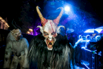 A participant dressed as a Krampus creature walks the street during the Krampus gathering in Goricane, Slovenia, Nov. 21, 2015. In Central European alpine folklore, Krampus is a demonic creature traditionally following St. Nicholas and angels on the evening of December 5. It pries on children who were not good during the year.