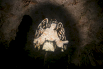 An angel is projected onto a cave ceiling during the world's largest live Nativity scene in a cave, staged in the world-famous Postojna Cave in Slovenia, Dec. 25, 2015.