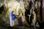 Actors perform in a biblical scene during the world's largest live Nativity scene in a cave, staged in the world-famous Postojna Cave in Slovenia, Dec. 25, 2015.