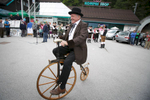 A man rides an old wooden bicycle at the opening ceremony of the 19th Hrast Memorial, the international oldtimers\' mountain race in Ljubelj, Slovenia, Sep. 13, 2015.