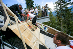 A competitor reaches the finish after running up the ski flying hill during the Red Bull 400 race in Planica, Slovenia, Sep. 19, 2015.