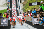 Winner Ahmet Arslan from Turkey (L) and second placed Luka Kovacic from Slovenia (R) run up the ski flying hill during the Red Bull 400 race in Planica, Slovenia, Sep. 19, 2015.
