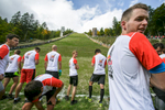 Competitors wait at the starting line before running up the ski flying hill during the Red Bull 400 race in Planica, Slovenia, Sep. 19, 2015.