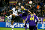 Eric Maxim Choupo-Moting of FC Schalke 04 is challenged by Aleksander Rajcevic of NK Maribor during the UEFA Champions League Group G match on December 10 in Maribor, Slovenia.