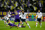 Eric Maxim Choupo-Moting of FC Schalke 04 is challenged by Petar Stojanovic of NK Maribor during the UEFA Champions League Group G match on December 10 in Maribor, Slovenia.