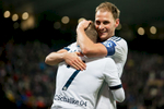 Benedikt Hoewedes of FC Schalke 04 hugs his teammate Max Meyer who scored against NK Maribor during the UEFA Champions League Group G match on December 10 in Maribor, Slovenia.