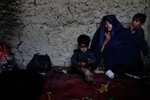 Single mother living in extreme poverty in a refugee camp outside Kabul