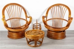 This design is a classic . The set includes a pair of 1960s {quote}egg{quote} chairs created by Palm Springs Rattan, part of their {quote}Garden Classics{quote} collection. The chairs are made from bamboo and rattan, and they rock and swivel seamlessly. Additionally, the set features a small side table and a magazine rack, all designed to complement a coastal aesthetic.Chairs: 35{quote} Length / 30{quote} Depth / 41{quote} HeightMagazine Rack: 21{quote} Length / 11{quote} Depth / 20{quote} HeightSide Table: 19{quote} Diameter / 12.5” HeightOur Price $1,200 