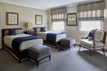 boys bedroom with twin beds in navy and taupe stanton burke midnight area rug