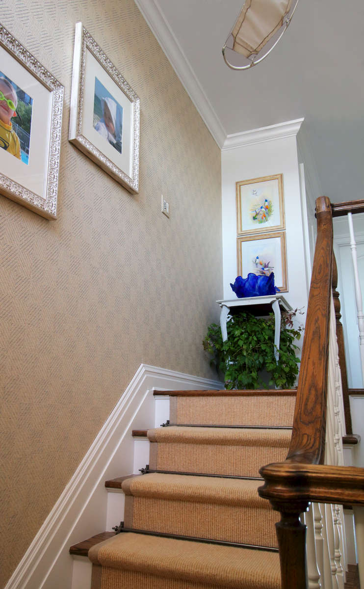 grasscloth wallcovering in the stairway
