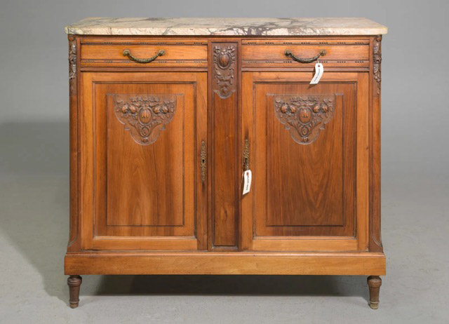 An exquisite 19th-century Louis XVI-style buffet represents a timeless interpretation of classical design, rooted in the traditions of ancient Greece and Rome. Featuring an original Breche marble top, this buffet is just under 4 feet wide, making it ideal for cozy niches or special spots within a room.45” x 18” x 40”Our Price $3,100