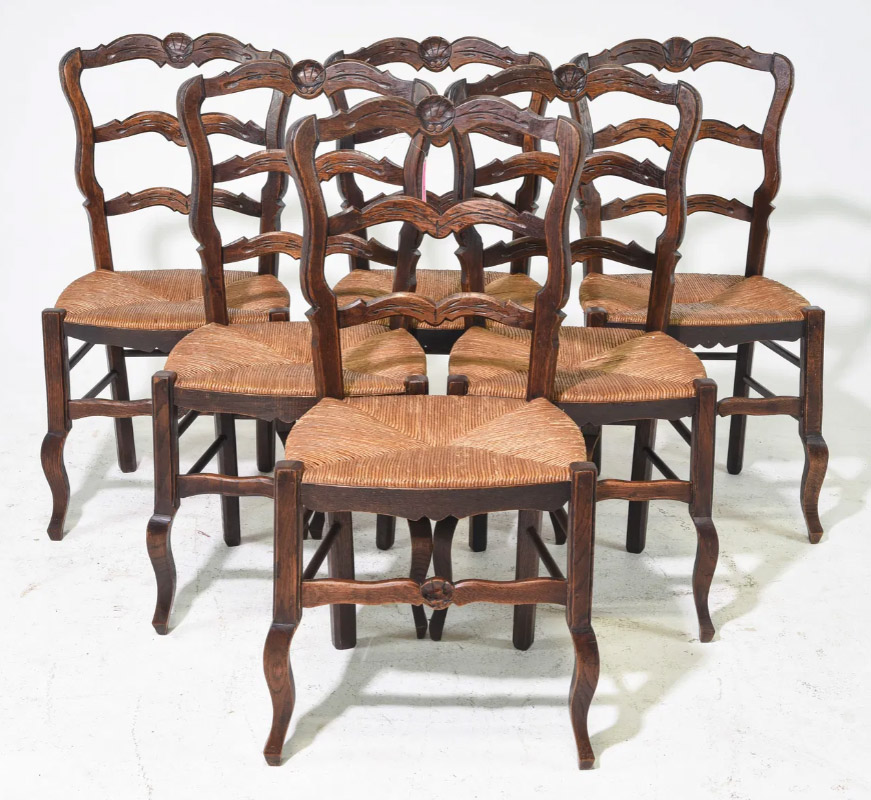 This charming set of six dining chairs is crafted from oak and features comfortable rush seats that are in good used condition. The cabriole legs connect to a turned stretcher, providing sturdy support for everyday use.16” x 15” x 35”Our Price $900