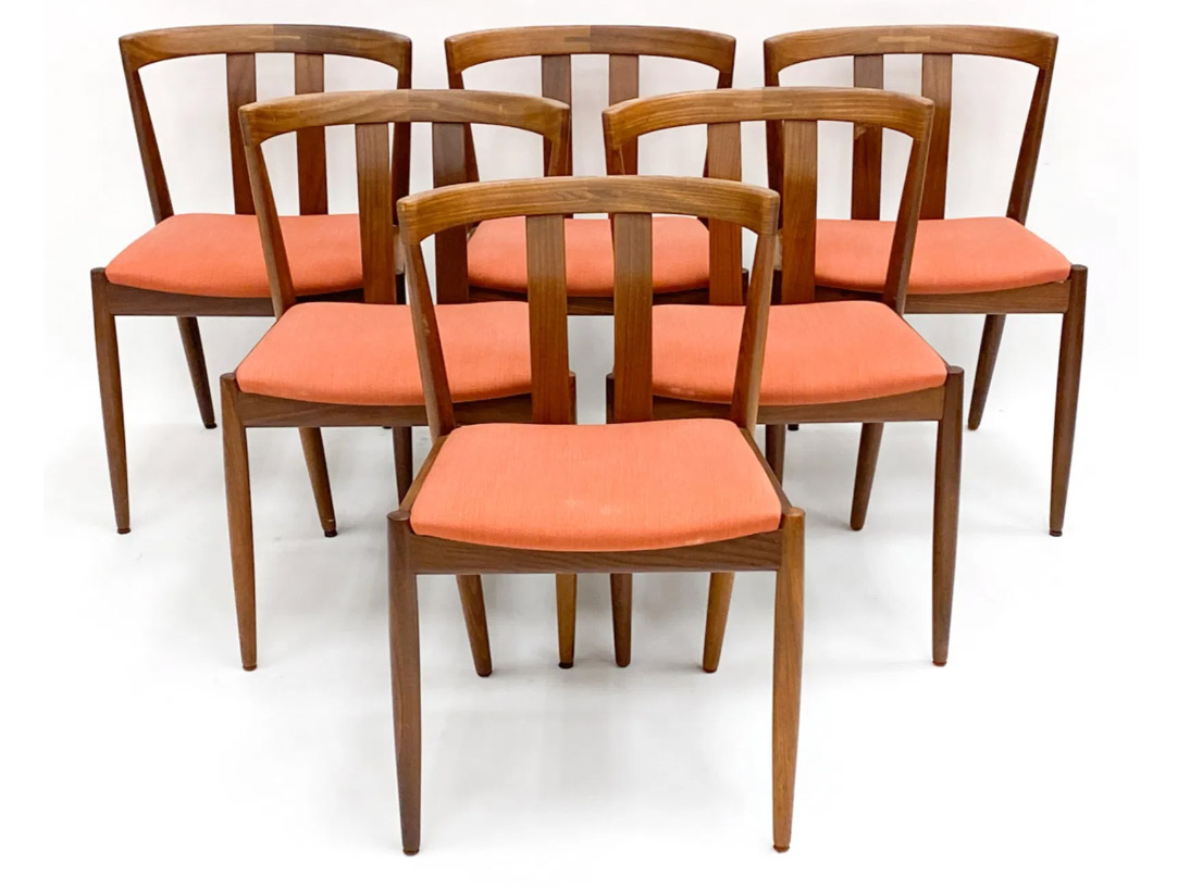 This set was crafted in Denmark and is sculpted from teak. The teak wood frames are both sturdy and elegant. The streamlined, minimalist frames feature rounded edges, tapered legs, and open wood backs. They are newly upholstered in a warm auburn tone that aligns with the latest design color trend.19{quote} x  19{quote} x 29.25{quote}Our Price $1,800