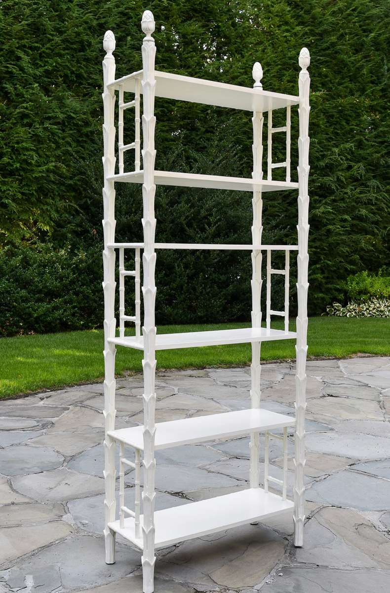 Enhance the elegance of any room in your home with this white wooden etagere. It features six fixed shelves, providing ample space for showcasing your favorite accessories. The open front and back, along with bamboo detailing on the sides and acorn finials, contribute a stylish touch.33{quote}W x 14 1/2{quote}D x 87”HOur Price $1,500