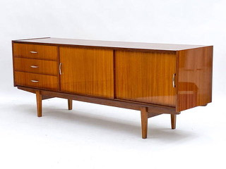 A French mahogany sideboard, credenza, or buffet featuring four doors that lead to a finely fitted interior made of sycamore. This large and impressive cabinet is simply stunning, showcasing long, sleek, tapering angled legs that support an interior fully equipped with drawers and two shelves.71.5{quote} x  17.75{quote} x  26.5{quote} Our Price $3,200