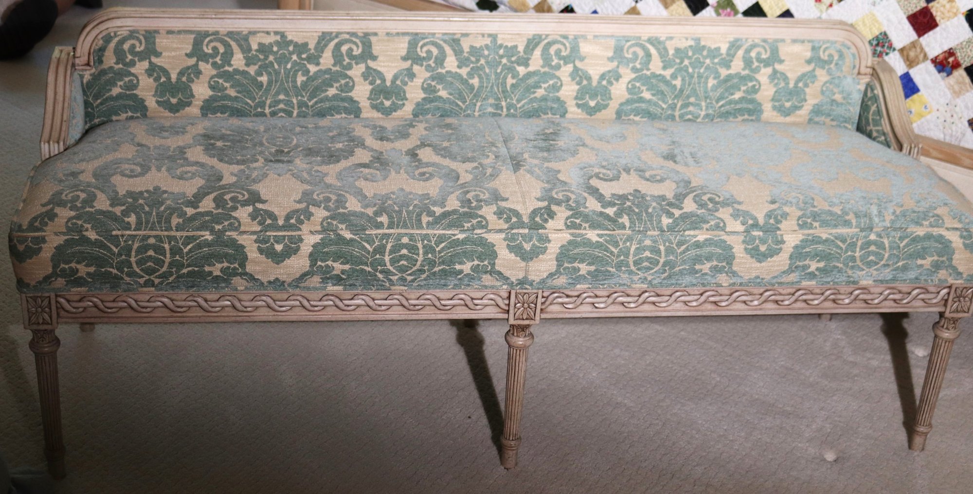 Carved Wood Louis XVI Style Bench, upholstered in a custom turquoise paisley pattern, adds interest and color to any room. The antique finish over light wood coordinates well with other woods in the space as well and adds a little elegance. 60” w x 20” d x 24”Our Price $1,200