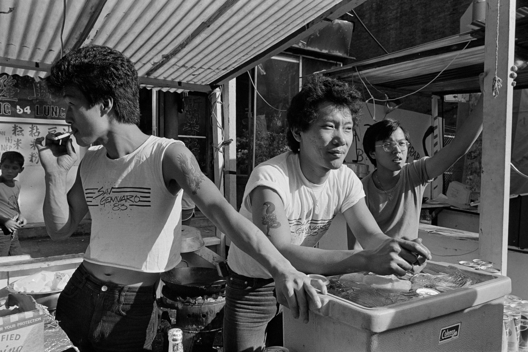 San Gennaro Festival, Mulberry St., New York City, 1983.These young men had a booth at the San Gennaro Festival. Within a day of this photo going up on the Hyperallergic website in early 2017, I was contacted by the young man on the right, now in his early 50s.