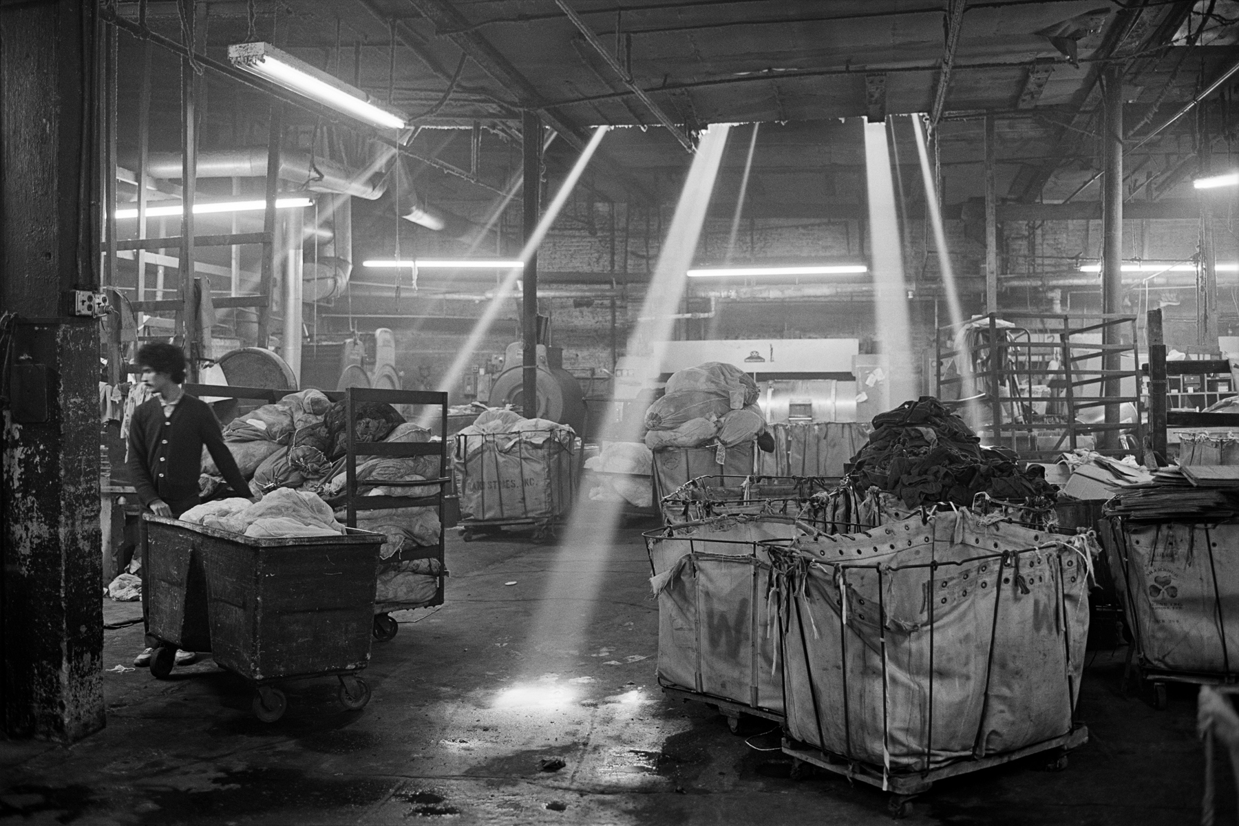Wing Gong wet wash, Greenpoint, Brooklyn, 1981.A wet wash was a factory size laundry, often with  a multicultural workforce. It had its roots in the exclusion of Chinese Americans from many occupations.