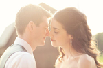 Glowy sunlight for a bride and groom's kiss at Misty Farms, Ann Arbor, Michigan. 