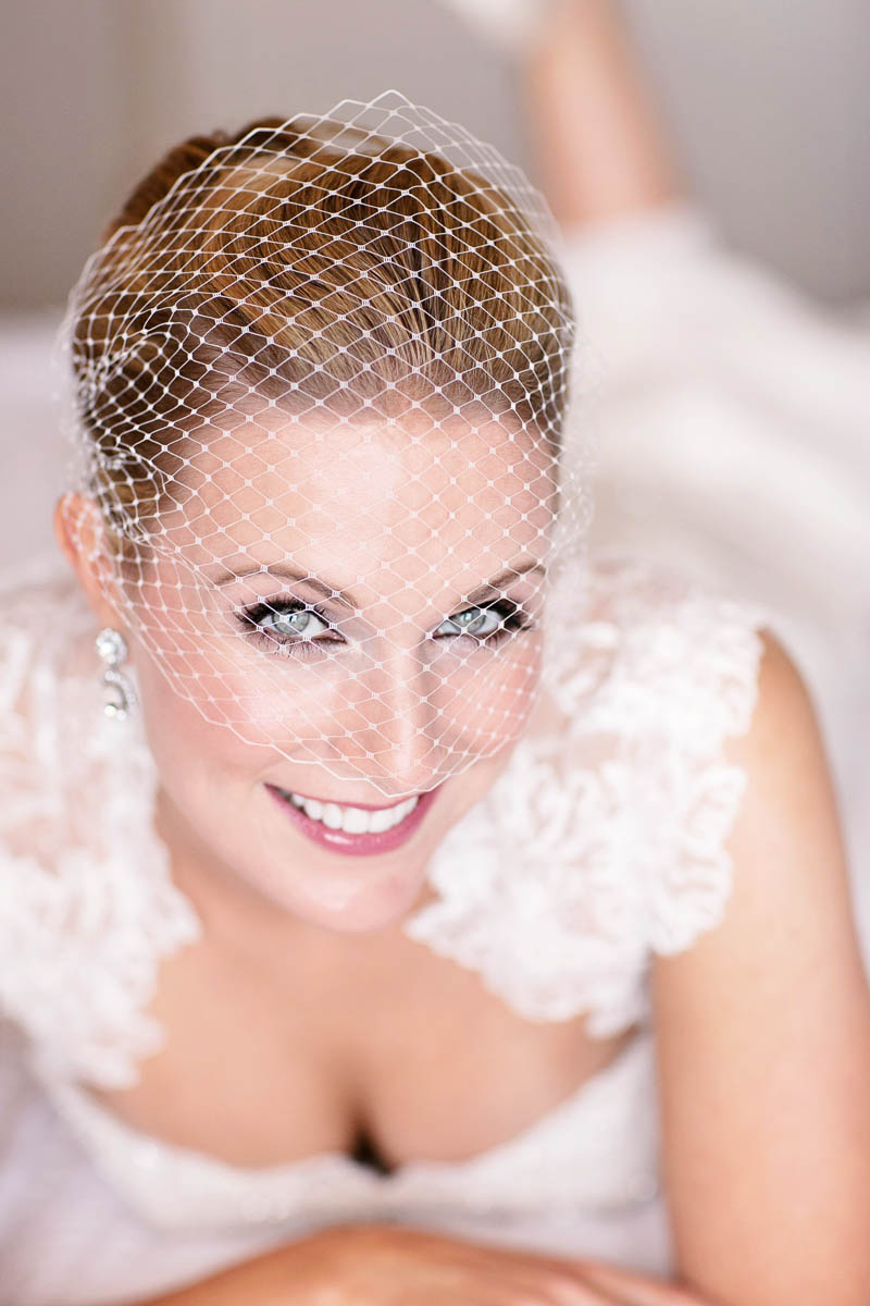 close up of a cage veil, blue eyed bride. 