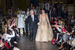 Audience applauded as designer Dennis Basso and model Hilary Rhoda walk together at the end of Dennis Basso's fashion show at the New York Fashion Week held inside Saint Bartholomew's Church located at 325 Park Avenue in Manhattan, New York on Monday, February 12, 2018.