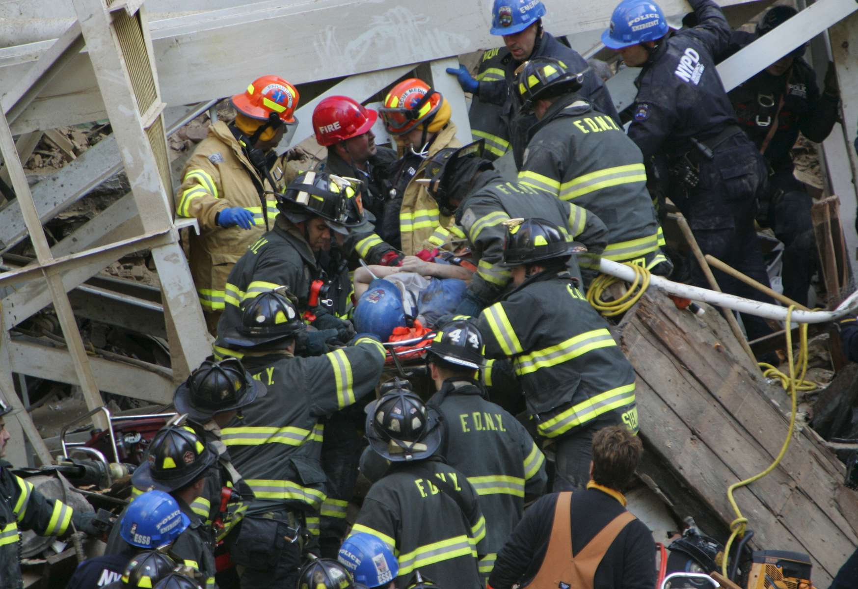 Firefighters rescue a survivor buried in the rubble after a crane collapse on a building located at 51st and 2nd Ave in Manhattan on March 15, 2008.