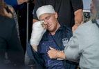 NYPD Police Officer Kenneth Healey, 25, who was brutally attacked in the head with a hatchet by Zale Thompson, an emotionally disturbed man, wipes his tears away as he is released from Jamaica Hospital Medical Center in Queens on Wednesday, October 29, 2014. He will be transferred to a rehab center.