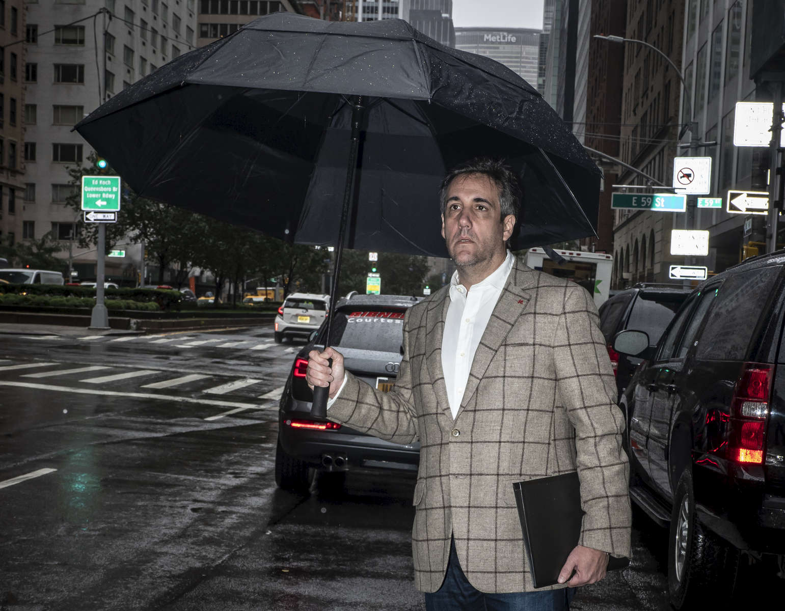 Lawyer Michael Cohen, who is the former lawyer of President Donald Trump, waits to get a taxi in front of Trump Park Avenue in Manhattan on Tuesday, September 25, 2018. He pleaded guilty to eight counts of campaign finance violations, tax fraud, and bank fraud. Michael Cohen was sentenced to three years in federal prison.