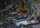 New Yorkers suffering from severe drug addiction and homelessness, sleep underneath an overpass in a space known as {quote}The Hole{quote} at the corner of St. Ann's Place and 150th Street in Mott Haven, the Bronx on September 3, 2015.  One day after Mayor de Blasio visited this South Bronx drug lair, Sanitation Department workers hauled out most of the addicts' piles of trash and the filthy furniture and dozens of syringes. As many as 20 men typically stayed at the site which has been a blight on the community for years. 