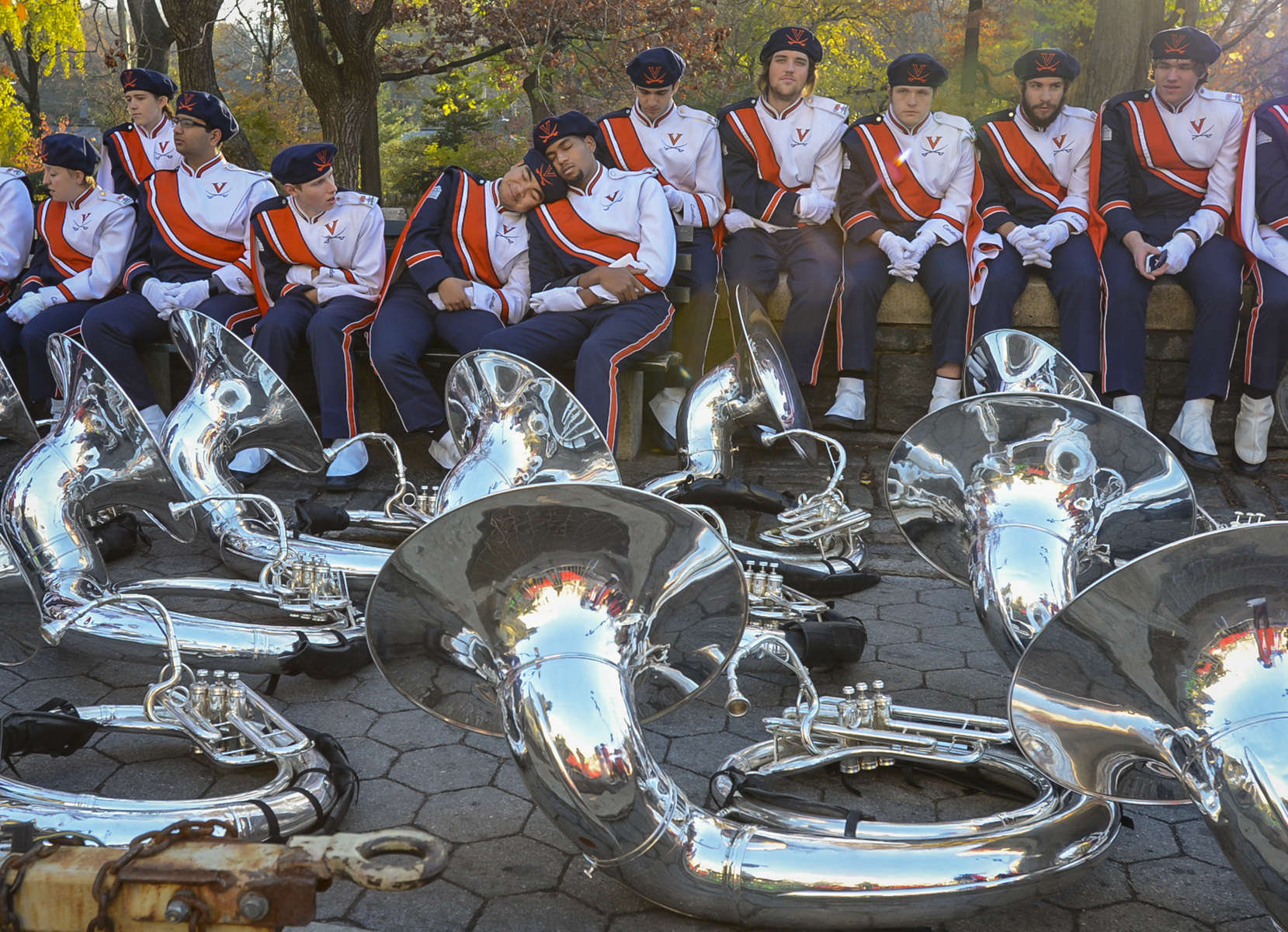 University of Virginia Marching Band members takes a rest along Central Park West during the Annual Macy's Thanksgiving Day Parade in Manhattan on Thursday, November 26, 2015.