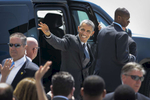 President Barak Obama waves to a crowd of supporters as he is escorted on the tarmac of John F. Kennedy International Airport from Air Force One to Marine One on May 4, 2015. The President was visiting New York City to do, among other things, visit Lehman College in the Bronx to launch the expansion of the My Brother’s Keeper Alliance initiative about race relations and opportunity, and a guest for an eight and final time on CBS’ “Late Show with David Letterman.” 