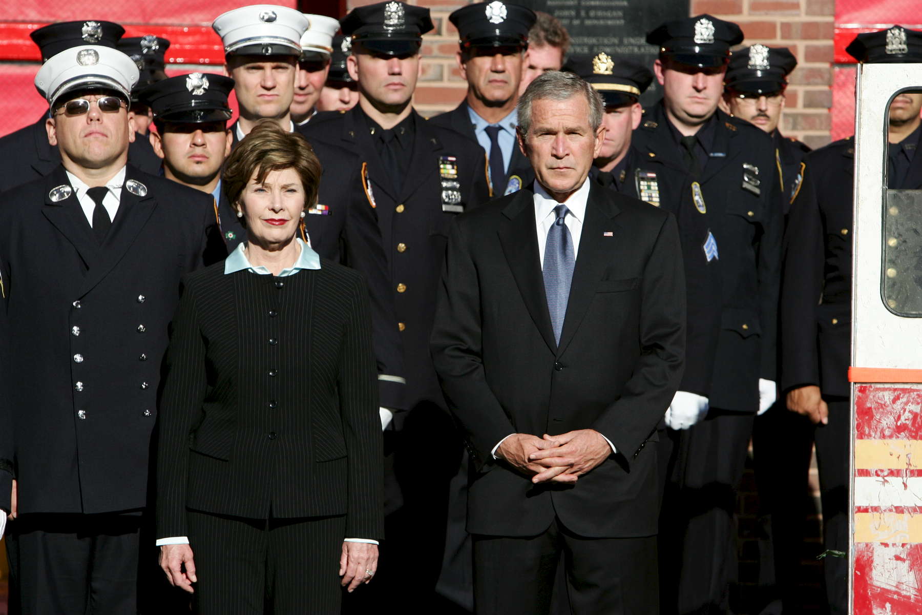 United States President George W. Bush and First Lady Laura Bush attend the 9-11 Tribute Ceremony honoring first responders outside Engine 15 Ladder 18 4th Battalion Chief Fire Station at 25 Pitt Street in Manhattan on Monday September 11, 2006. The President and First Lady spent their breakfast with first responders after attending the somber ceremony. 