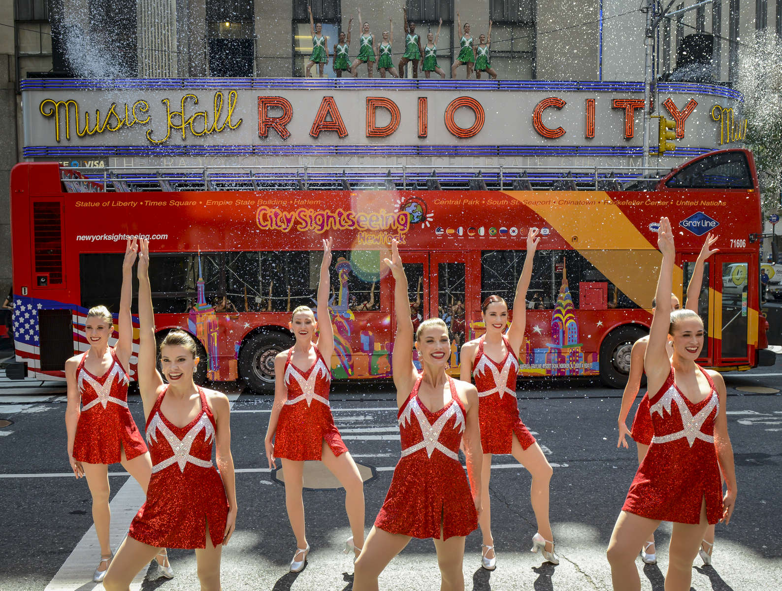 Radio City Rockettes stop traffic in front of Radio City Music Hall, as they promote the 2017 {quote}Christmas Spectacular Starring the Radio City Rockettes, presented by Chase{quote} along 6th Avenue between West 50th and West 51st Street in Manhattan on Thursday, August 17, 2017. 