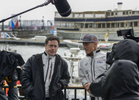 The Late Show host Stephen Colbert (left) interviews James Spithill (right), two time America's Cup Winning skipper for Oracle Team USA on the opening day of America’s Cup sailing competition at the Waterfront Plaza Brookfield Place located at 230 Vesey Street in Manhattan, May 6, 2016. 