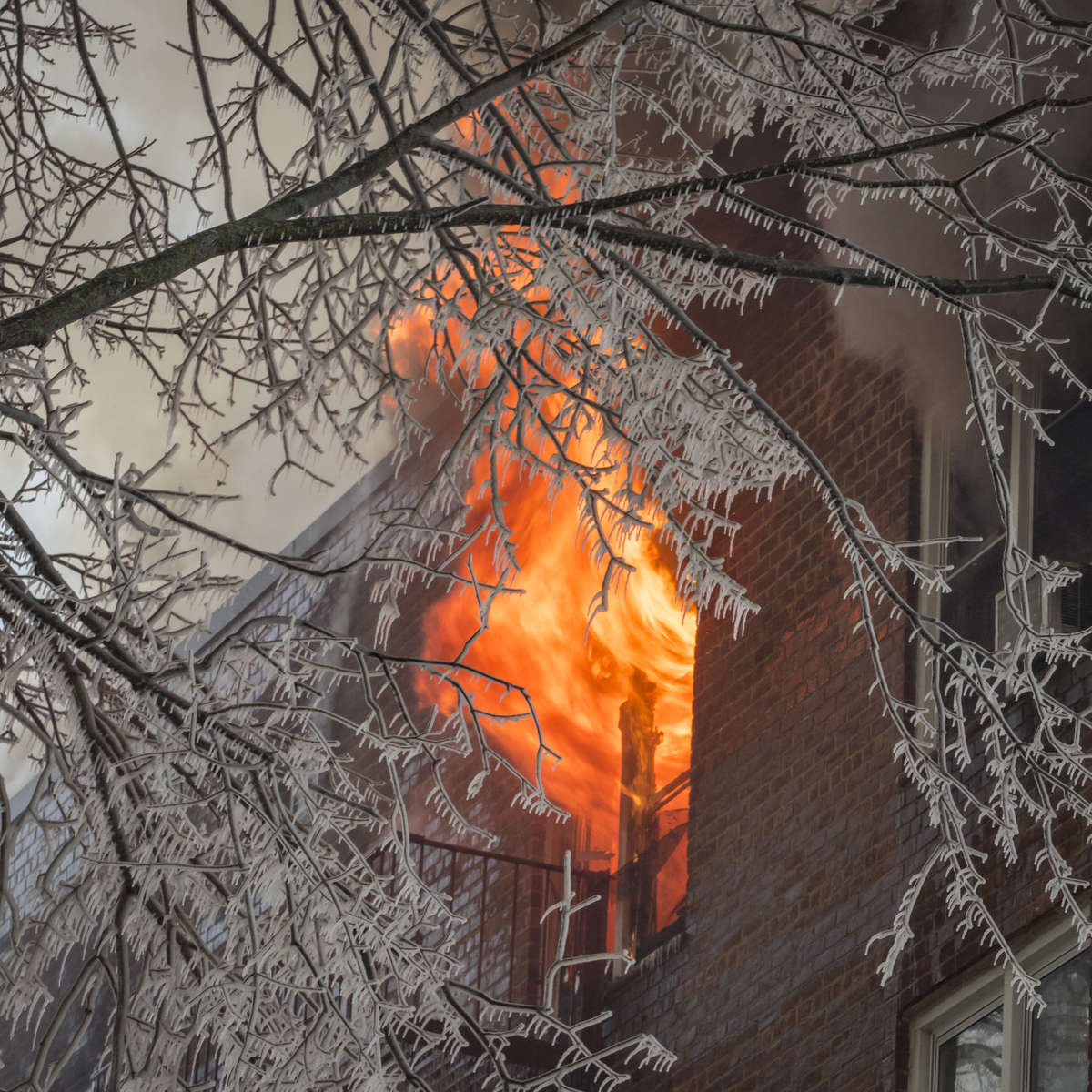 Firefighters battle a fatal 4-alarm fire that started on the 5th floor and quickly spread to the upper floors in the building located at 1 Hawley Terrace in Yonkers, New York on Wednesday, March 15, 2017.