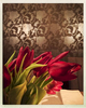A relaxing evening with fresh tulips reflecting the mood of the dining room walls.