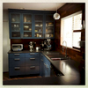 Blue delivers personality to this retro-house kitchen.Note the Brazilian hardwood backspalsh.