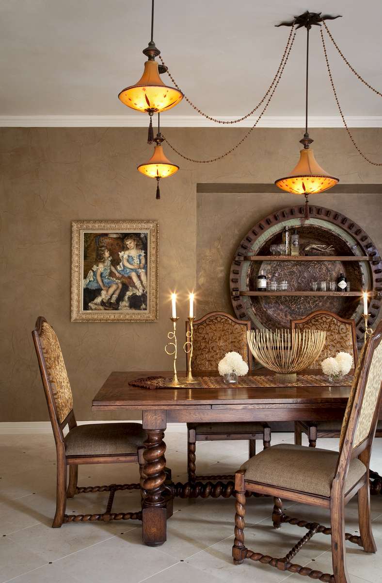 The wall plaster was infused with gold for luster.  The chandelier was left by a previous owner.  The chair fabric is from Place Textiles.