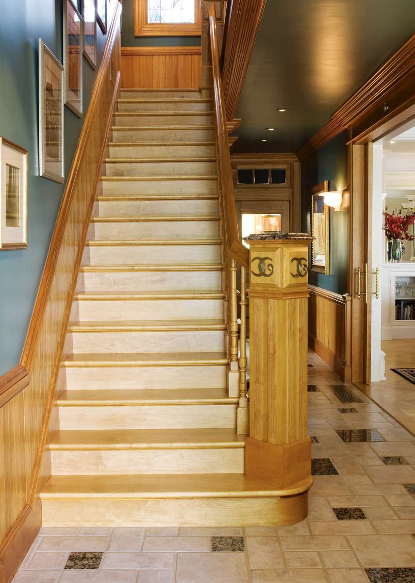 The stairs were rebuilt to code with styles from patterns in catalogs of the 19th century.  The wainscoting is individual beaded boards of clear pine.  The hall floors are italan tiles with inset granite tiles to be garden steps.  The logo of brass was made in Lunenburg.